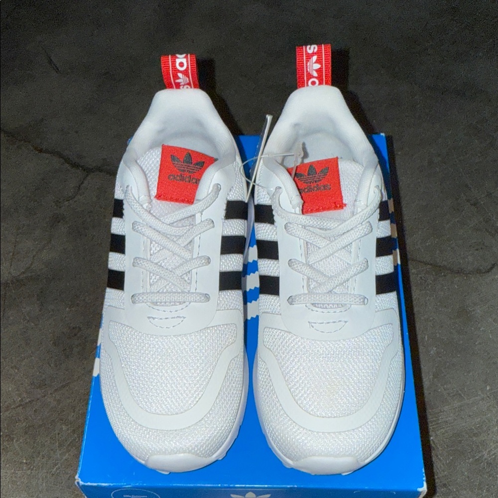 adidas White Sneakers with Black Stripes and Red Accents
